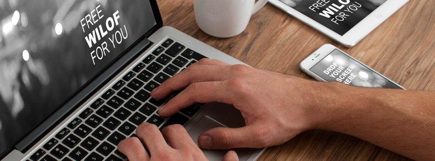 working in a laptop with tablet and Smartphone